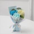 Detailed soap flower bouquet with blue roses and eucalyptus leaves in paper wrapping - Light Blue