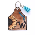 Western style leather keychain with sunflower pattern, letter W, and blue tassel detail - Letter W