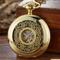 Vintage gold hollow mechanical pocket watch displayed on a rustic wooden gift box - Gold