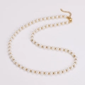 Detail of vintage pearl necklace with gold spacer beads and secure lobster clasp closure - Gold Color Necklace (5mm)
