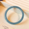 Elegant blue translucent agate bangle bracelet on beige ribbed fabric background - Thick: Smoke Blue 60mm Diameter Bangle