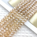 Macro shot of 8mm champagne faceted crystal watermelon beads for DIY jewelry making - Amber Gold