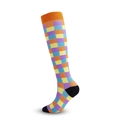 Colorful checkered compression socks with orange ribbed cuffs and black heel accents - Grid Blocks
