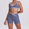 Detail of grey-blue yoga set with white contrast piping and V-shape waistband - Blue Gray