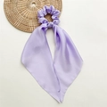 Close-up of lavender purple satin bow scrunchie with long ribbons on a minimalist background - Light Purple