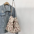 Detail of floral canvas tote bag showing the vintage red flower pattern and fabric texture - Rhodonite