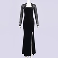 Detail of elegant black velvet dress with mesh sleeves and a high side slit feature - S / Black