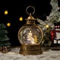 Bronze Christmas nativity snow globe lantern with glitter and warm holiday background - Nativity Scene