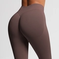 Detail of high-waist seamless yoga leggings in tan brown showing peach lift effect - Coffee