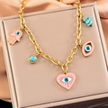 Golden titanium steel jewelry set with evil eye charms and pink heart on champagne silk - Necklace