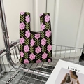 Chic dark brown knitted tote bag featuring pink floral patterns and a soft woven texture - Pink Lavender