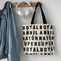 Detail of canvas tote bag featuring cute yellow rabbit illustration and typography print - Beige Rabbit Letter