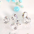 Macro shot of silver spacers with iridescent rhinestones and floral accents - Silver Plated AB Crystal