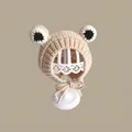 Close-up of knit frog baby hat with large eyes and secure chin straps for winter - Little Frog Hat Beige (2 Months - 2 Years Old)