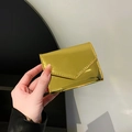 Fashionable shiny gold metallic envelope wallet with glossy finish and stitching detail - Gold