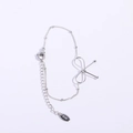 Pulsera de lazo plateada en acero inoxidable con placa K18 y cadena ajustable - Pulsera / Color Acero