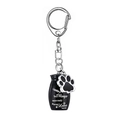 Black cremation urn keychain with pet paw charm and memorial engraving in studio light - Black