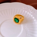 Detailed close-up of gold-plated square green zircon ring on a decorative plate - 10# Ring - Gold - Green