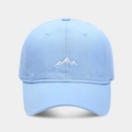 Close-up of a light blue cotton baseball cap featuring detailed white mountain embroidery - Adjustable / Light Blue