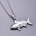 Macro shot of silver fish pendant with detailed scale textures and stainless steel chain - Steel Color + Necklace Chain