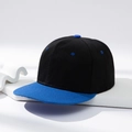 Two-tone snapback baseball cap in black and bright blue with a flat brim on a minimalist stand - Black with Blue Brim