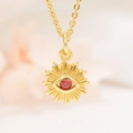 Detailed macro shot of a gold Evil Eye pendant featuring a central red zircon stone and micro-inlays - K303 Bright Red Eye Pendant And Chain (ZYN-DMK303G)