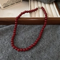 Detailed close-up of dark red glass beaded necklace with a silver metal clasp fastener - 3# Necklace - Red (7mm)