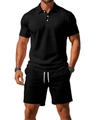 Detail of black summer polo and shorts set showing breathable knit texture on male model - S / Black