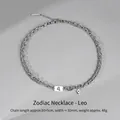 Silver Leo zodiac necklace featuring double-layer Cuban chains and blue stone charm - Leo