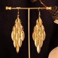 Detail of gold layered leaf tassel earrings on a display stand with a macro focus - Frosted Marquise / Gold