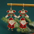 Christmas earrings featuring red candy cane and Santa Claus charms in gold finish - Santa Candy (11914)