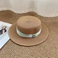 Tan straw flat top hat with mint green satin ribbon on a textured woven rug - M / Khaki with Lime Green Bow
