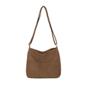 Minimalist brown corduroy bucket bag with adjustable shoulder strap on white background - Brown