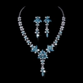Detailed view of bridal crystal necklace and blue rhinestone earrings set on black background - Aquamarine Rhinestone Silver Plated