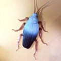 Realistic toy cockroach model with blue-black gradient body and red-brown limbs - Brown Simulation Cockroach