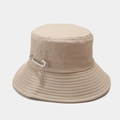 Detailed view of beige canvas bucket hat featuring a stylish silver rhinestone pin accessory - Khaki
