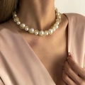 Vintage gold twisted chain necklace with chunky baroque pearls on an elegant model - Gold Chain Pearl Necklace