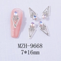 Macro shot of V-shaped alloy nail charms with teardrop iridescent stones and small rhinestones - Silver Base Starry Pink (9668)