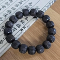 Sandalwood Buddhist prayer beads with mantra carvings on traditional calligraphy backdrop - Ebony Mantra Carved Style / 12mm*17 Beads / Black