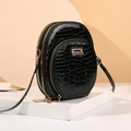 Elegant black crocodile-patterned crossbody bag with gold zippers and dual compartments - Black
