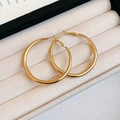 Elegant gold round stud earrings displayed in a beige velvet jewelry gift box - Large Round Hoop Earrings