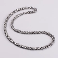 Detailed close-up of a silver stainless steel square Byzantine king chain for men - Silver