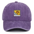 Close-up of purple washed cotton baseball cap with sun and clouds embroidery patch - Purple