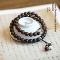 Golden Phoebe wood buddhist prayer beads with lotus charm and elegant tassel detail - Golden Sandalwood 8mm Lotus Double Circle Bracelet