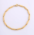 Detalle de pulsera de cadena dorada de acero inoxidable con cierre de langosta pulido - Cadena de Semilla de Melón / Dorado