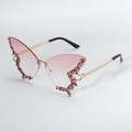 Detailed shot of trendy butterfly-shaped rhinestone rimless sunglasses with gradient pink lenses. - Gradient Red