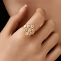 Golden bow-shaped luxury ring with sparkling zircon stones worn on finger - KR0085-1/Luxury White Cluster Ring