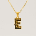Golden stainless steel necklace featuring a letter E pendant with black bark texture - Gold Letter E