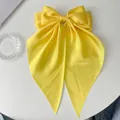 Elegant large yellow satin bow hair clip with long ribbons on white background - Long Streamer Spring Clip / Bright Yellow