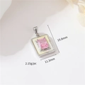 Detail shot of vintage silver pendant with pink stone and white shell, 19.8x11.3mm - Palladium H-11784 Pink Zircon Rectangle